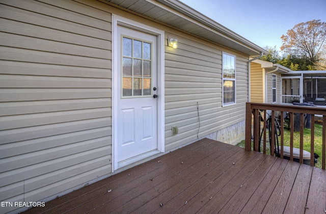 deck with a sunroom