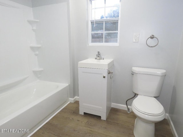 full bathroom featuring vanity,  shower combination, toilet, and wood-type flooring