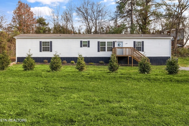 back of property featuring a yard