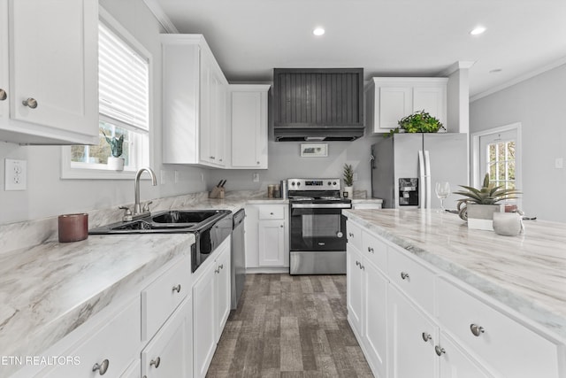 kitchen featuring sink, light stone counters, dark hardwood / wood-style floors, white cabinets, and appliances with stainless steel finishes