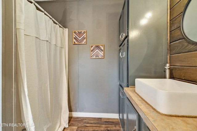 bathroom with vanity and hardwood / wood-style flooring