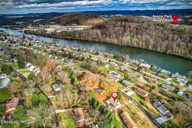 drone / aerial view with a water and mountain view