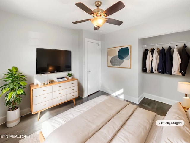 bedroom with ceiling fan and a closet