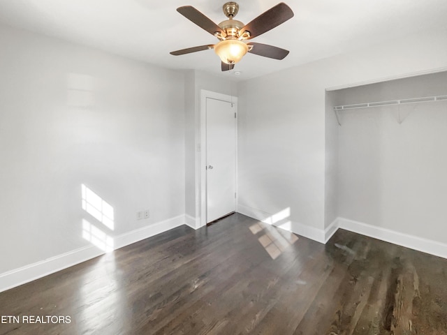 unfurnished bedroom featuring dark hardwood / wood-style floors, a closet, and ceiling fan