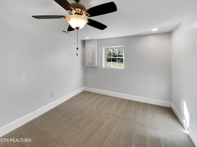 carpeted empty room featuring ceiling fan