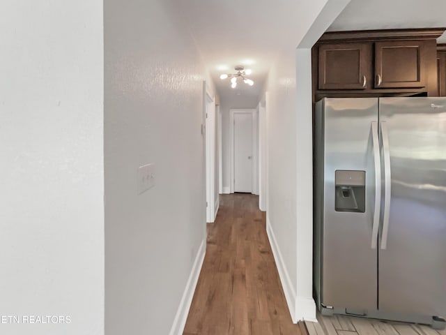 hall with light hardwood / wood-style flooring