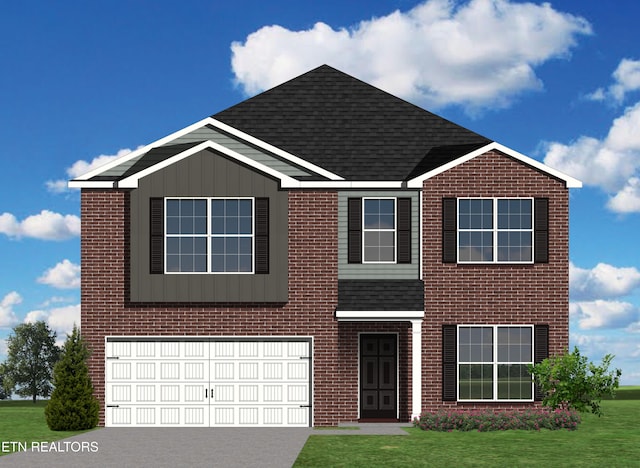 view of front of home with a garage and a front yard