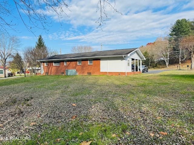 115 Greasy Cove Rd, Cosby, TN 37722 - back of property with brick siding and a lawn
