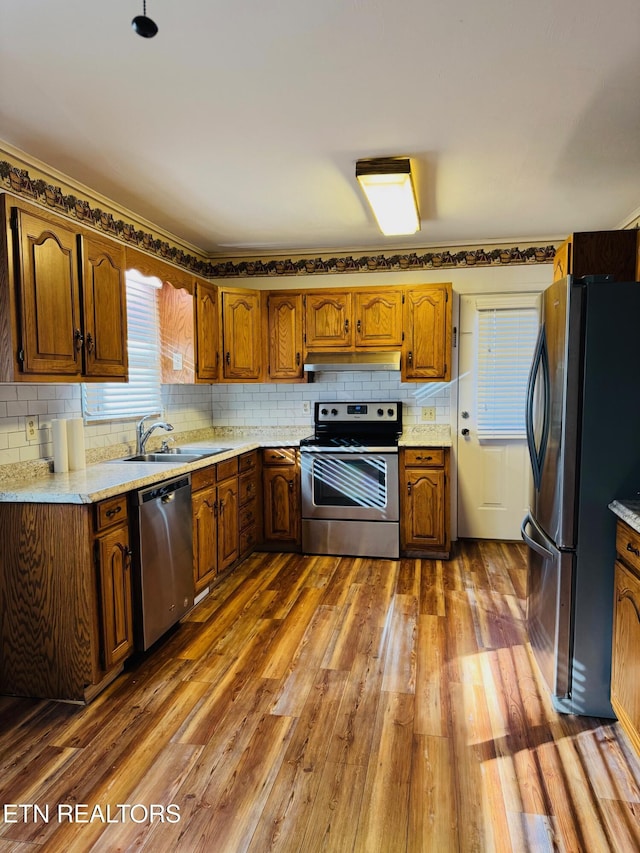 115 Greasy Cove Rd, Cosby, TN 37722 - kitchen featuring appliances with stainless steel finishes, wood finished floors, and tasteful backsplash