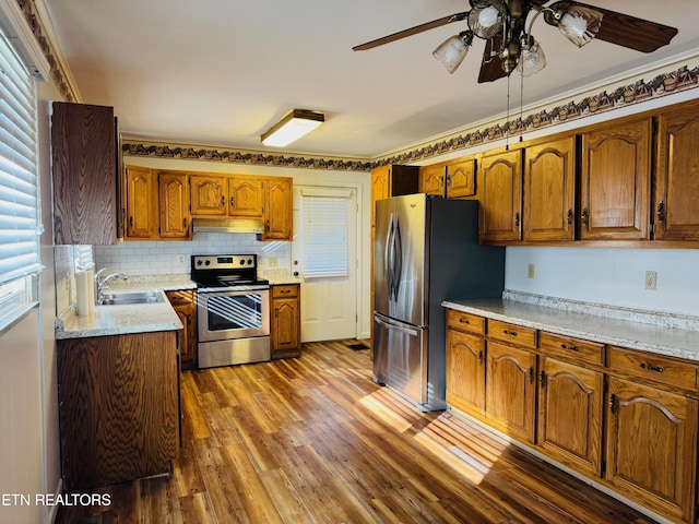 115 Greasy Cove Rd, Cosby, TN 37722 - kitchen featuring stainless steel appliances, under cabinet range hood, a ceiling fan, and brown cabinetry