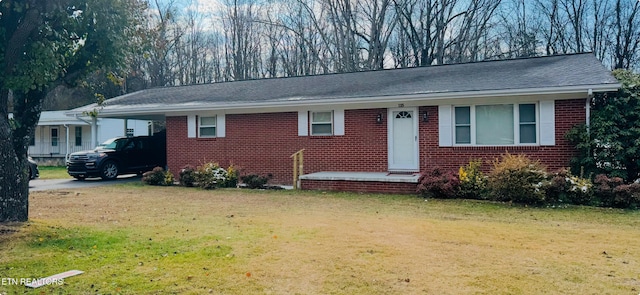 ranch-style home with a front lawn