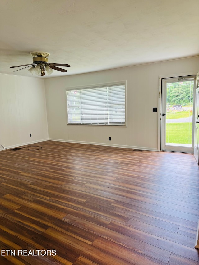 115 Greasy Cove Rd, Cosby, TN 37722 - unfurnished room featuring dark wood-style flooring, plenty of natural light, and ceiling fan