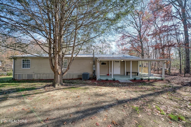 view of front facade featuring covered porch and central AC unit