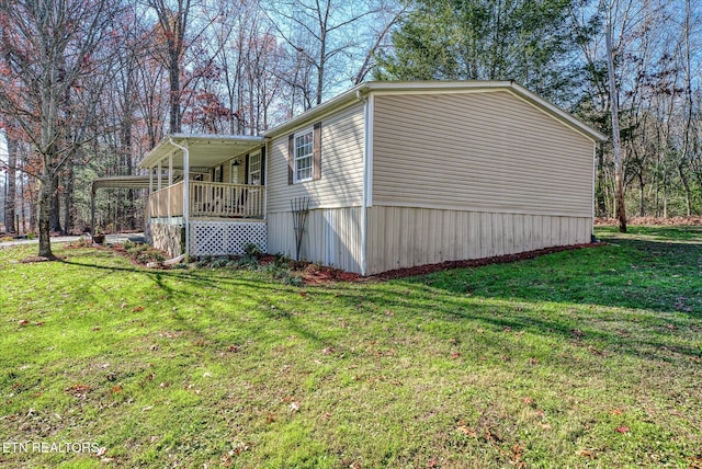 view of side of home featuring a yard