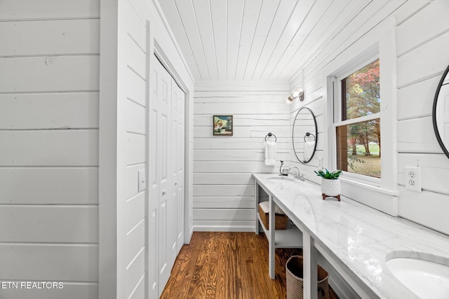 bathroom featuring wood ceiling, vanity, wood-type flooring, and wooden walls