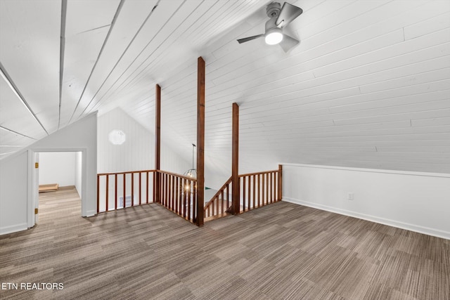 bonus room featuring ceiling fan, wood-type flooring, and lofted ceiling