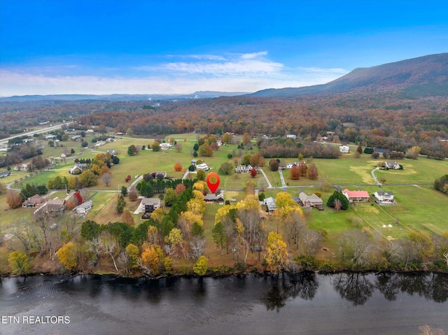 aerial view featuring a water and mountain view