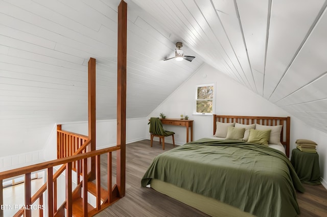 bedroom with ceiling fan, wood-type flooring, and lofted ceiling