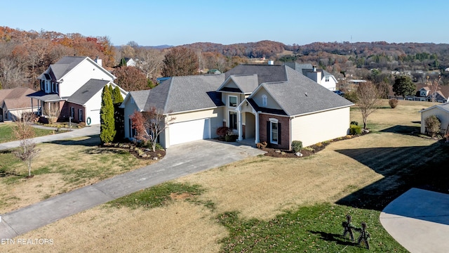 drone / aerial view featuring a mountain view