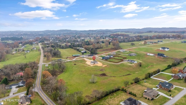 birds eye view of property featuring a rural view