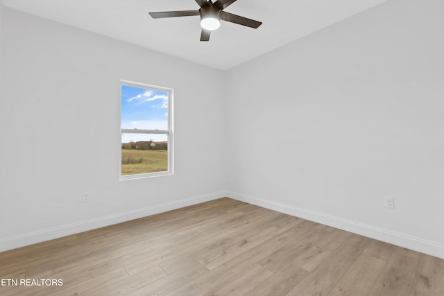 unfurnished room featuring ceiling fan and light hardwood / wood-style floors