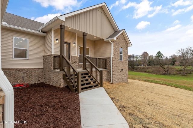 view of exterior entry featuring a porch