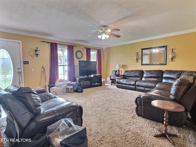 living room featuring carpet flooring, a textured ceiling, ceiling fan, and ornamental molding