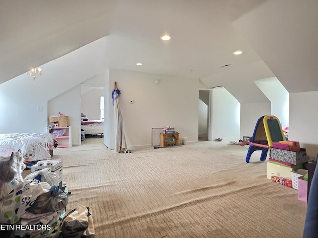 game room with an inviting chandelier, light carpet, and vaulted ceiling