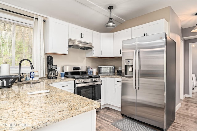 kitchen featuring pendant lighting, white cabinetry, and appliances with stainless steel finishes