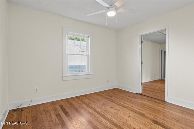 empty room featuring ceiling fan and light hardwood / wood-style floors