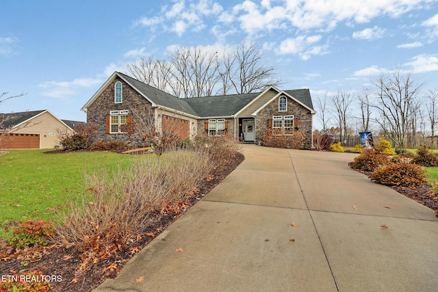 ranch-style home featuring a front yard and a garage