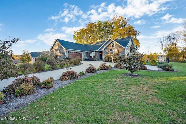 view of front facade featuring a front yard and a garage