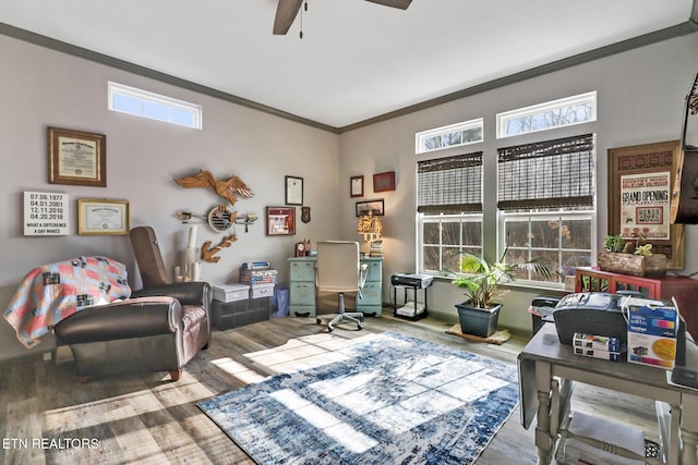 sitting room with crown molding, hardwood / wood-style flooring, and ceiling fan