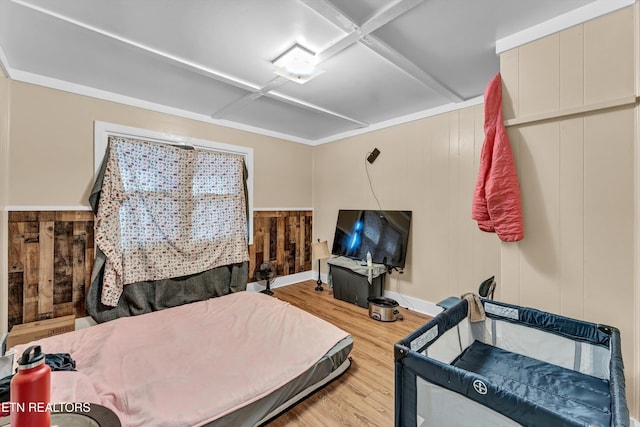 bedroom with hardwood / wood-style flooring, wooden walls, and coffered ceiling