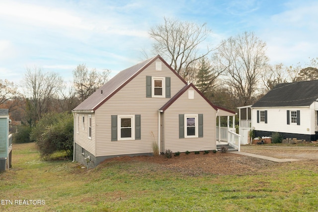 view of side of home featuring a yard