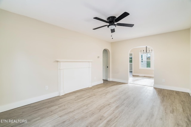 unfurnished room featuring ceiling fan and light hardwood / wood-style flooring