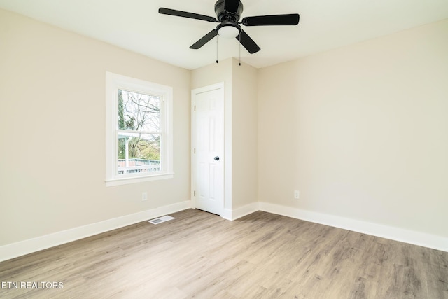 unfurnished room featuring light hardwood / wood-style floors and ceiling fan