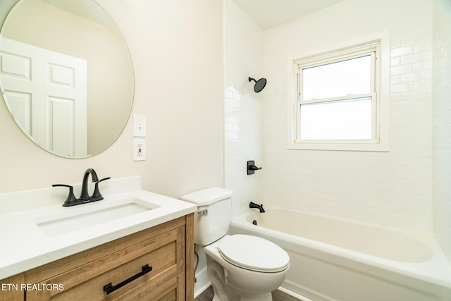 full bathroom featuring vanity, toilet, and tiled shower / bath