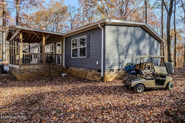 view of side of home with cooling unit