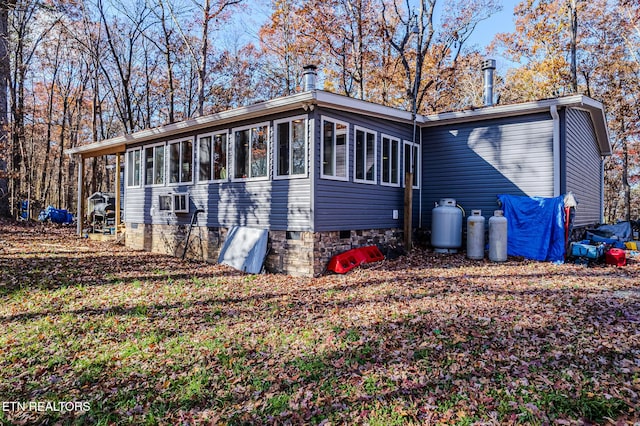 back of property featuring a sunroom