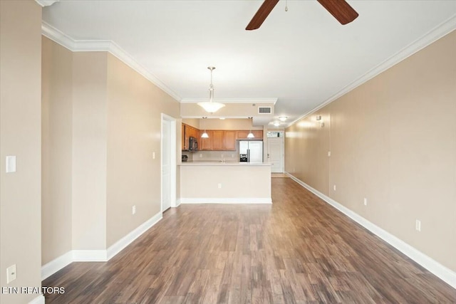 unfurnished living room featuring ceiling fan, hardwood / wood-style flooring, and ornamental molding