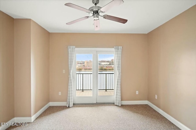 unfurnished room with carpet flooring and ceiling fan