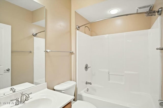 full bathroom featuring vanity, bathtub / shower combination, and toilet