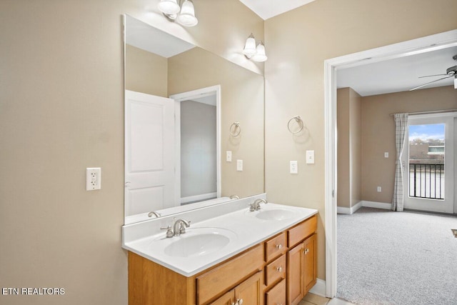 bathroom featuring ceiling fan and vanity