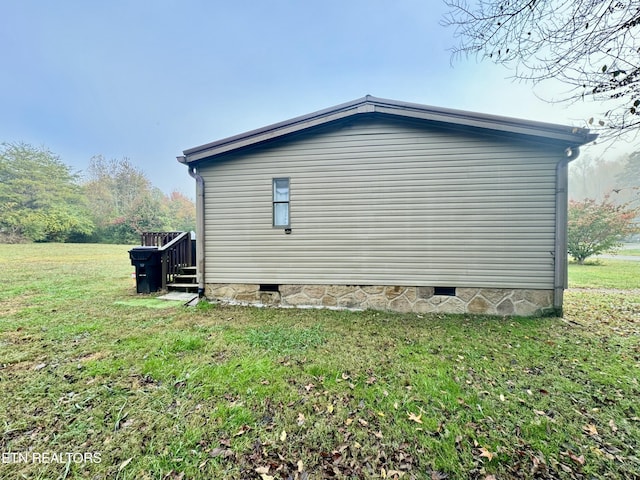 view of property exterior with a yard