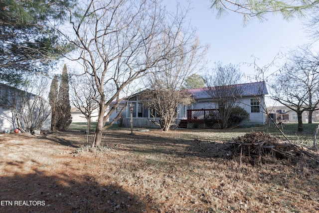 back of property with a wooden deck