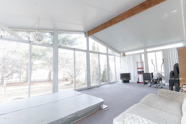 sunroom / solarium with lofted ceiling with beams and a wealth of natural light