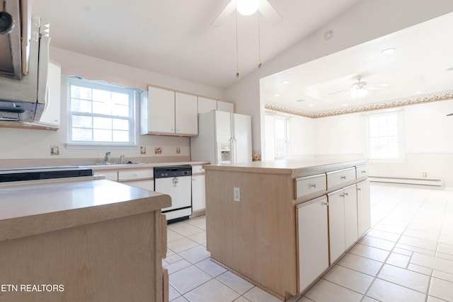 kitchen with ceiling fan, a center island, baseboard heating, white appliances, and white cabinets