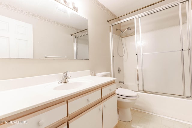 full bathroom with vanity, toilet, and bath / shower combo with glass door