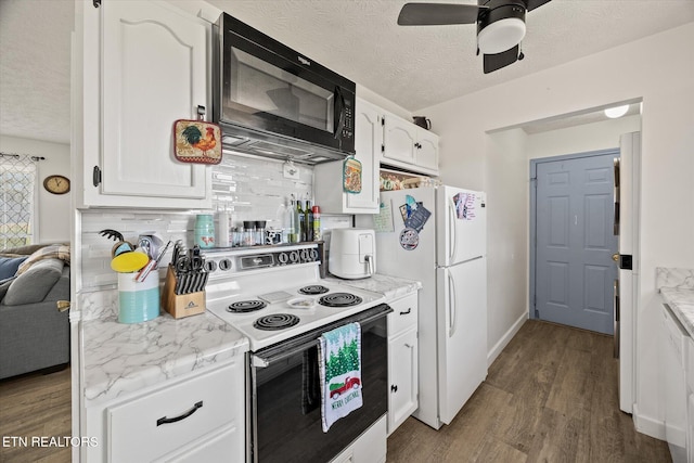 kitchen featuring a textured ceiling, white appliances, ceiling fan, white cabinets, and dark hardwood / wood-style floors